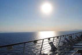 sun over sea sky clouds