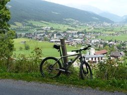 mountain bike stands on top of a hill