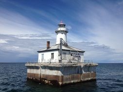 Lighthouse with dwelling in Sea