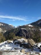 Beautiful river among stones in a valley with green trees in Yosemite