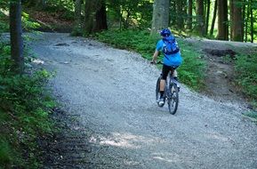 landscape of cyclist on a mountain trail in the forest