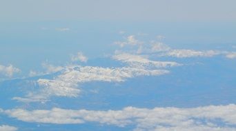 snow peaks like clouds