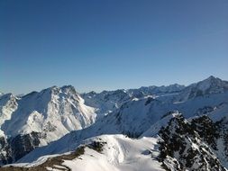 panorama of snowy alps in austria on a sunny day