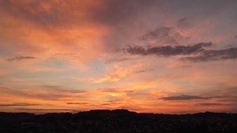 orange sky over the hills