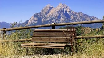 Old bench at fence in view of pedraforca Mountain, spain, pyrenees