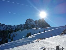 bright sun over winter mountains