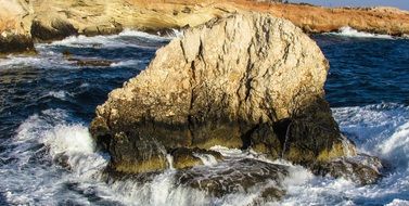 waves around a large stone