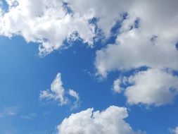 large white clouds on a clear sky