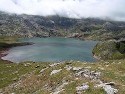 panorama of a mountain lake and fog over the Pyrenees