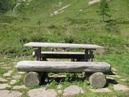 wooden bench on a mountain on a sunny day