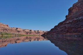 canyon reflected in a river in utah