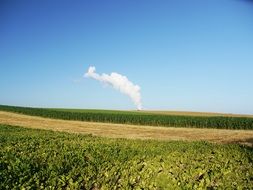 nuclear power plant behind green fields, germany, heilbronn