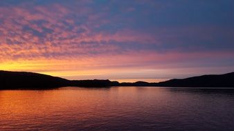 orange sky over the lake at dusk