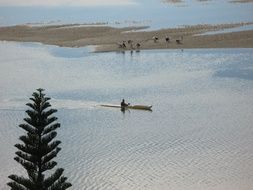 panoramic view of a kayaker in the low tide