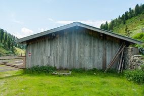 wooden shed at the foot of the mountains in Austria