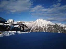 mountains in the snow near the lake in winter