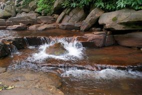 foaming water flow among rocks
