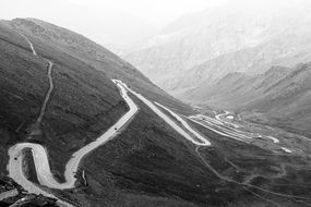 black and white photo of a zigzag mountain road in Pakistan