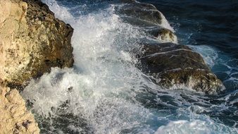 ocean waves breaking on rocky coast