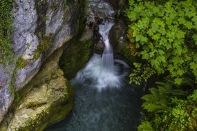 panoramic view of a waterfall among the rocks in switzerland