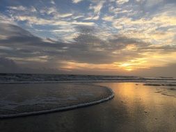 clouds at sunset over the ocean coast