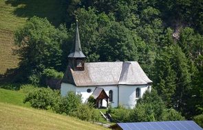 small white Chapel in beautiful summer Landscape