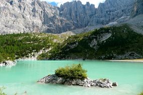 lake with blue water among the rocky mountains