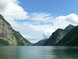 lake at the foot of an alpine mountain