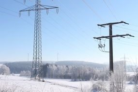 power lines amid a winter landscape