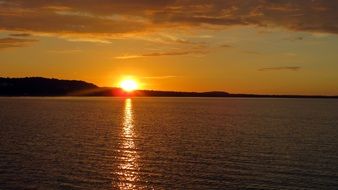 landscape of romantic sunset on the golden water