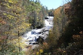 river among stones in the autumn forest