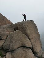 man on a huge rock