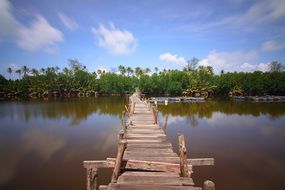 long wooden pier on the river like a footbridge
