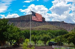 American flag on a background of mountains