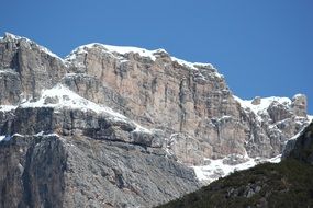 dolomite mountains in the snow on a sunny day