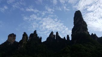 dark silhouettes of mountains against the blue sky in China