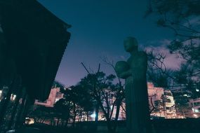 statue near the temple in seoul at dusk