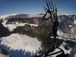 extreme paragliding in mountains in winter