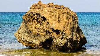Colorful Rock on the beach with beautiful blue water in Cyprus in the summer