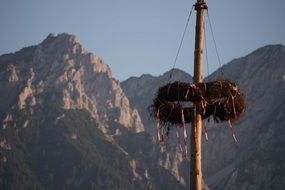maypole with wreath at Rocky Mountains, Tyrol