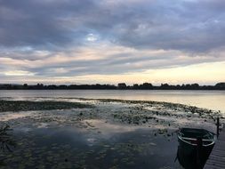 Boat on the beautiful Lake under the colorful sunset