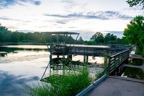 fishing dock on pond in park, nobody