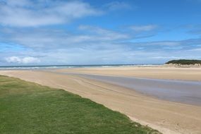 empty road on sand beach at water