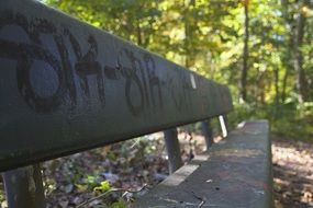 bench with inscriptions in the park close-up