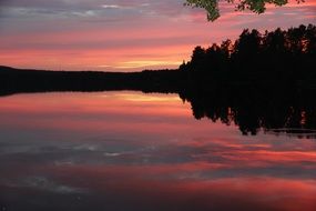 pink romantic sunset over the lake