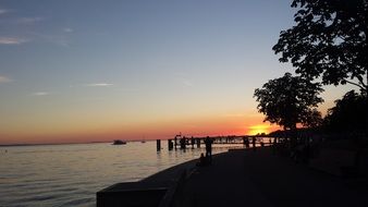 Landscape of sunset over the pier on Lake Constance