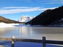 landscape of mountain lake in winter in Dolomites