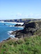 black cliffs on the coastline in England