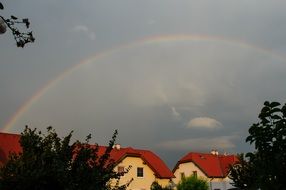 beautiful rainbow over red houses