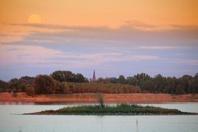 sky in a sunset glow over a picturesque landscape